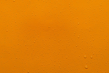 Wall Mural - close-up water drop orange background