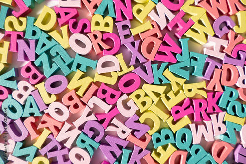 Plenty of colorful wooden letters on a White background Tableau sur Toile