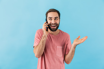 Poster - Optimistic positive man talking by mobile phone.