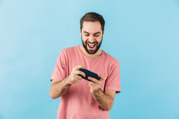 Canvas Print - Happy man isolated over blue wall background