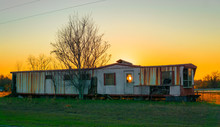 Traditional American Mobile Home Abandon Poverty In Country At Sunset 