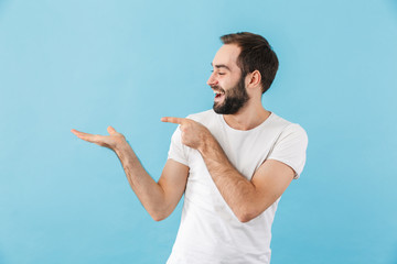 Sticker - Portrait of a young cheerful bearded man wearing t-shirt