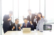 © eakgrungenerd - Group of asian business people cheerful manager meeting work room planning and successful, Teamwork seccessful concept.