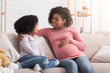 © Prostock-studio - Pregnant Woman And Her Cute Daughter Spending Time Together At Home
