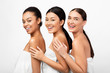 © Prostock-studio - Three Mixed Girls In Bath Towels Posing Over White Background