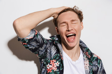 Poster - Image of curly cheerful man posing laughing at camera with eyes closed