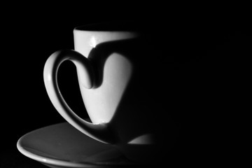 Shadow of a cup handle make shadow of a heart with selective lighting