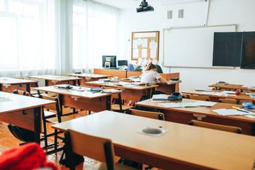 Empty classroom with school supplies, black board