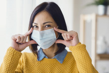 Portrait Of Young Asian Woman, Wearing A Medical Surgical Disposable Face Mask To Prevent Infection, Virus, Air Pollution