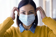 © lordn - Portrait of young Asian woman,  wearing a medical surgical disposable face mask to prevent infection, virus, air pollution