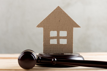 Real estate sale auction concept - gavel and house model