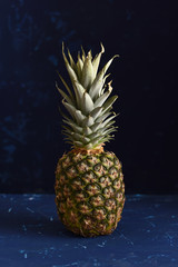 Pineapple on dark blue background