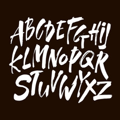 Wall Mural - vector acrylic brush style hand drawn alphabet font. calligraphy alphabet on a black background