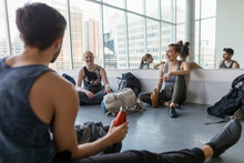 Dancers Stretching And Relaxing After Dance Class
