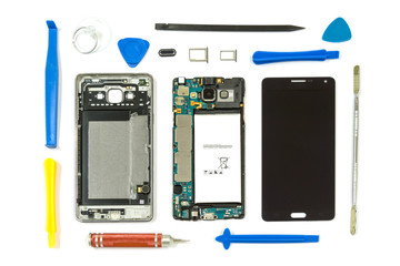 Disassembled smartphone with phone tool on white background, Repair Service, isolated.