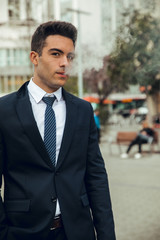 Wall Mural - Boy in suit smoking with vaper