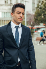 Wall Mural - Boy in suit smoking with vaper