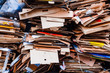 A bunch of stacked, sorted and laid out a variety of cardboard boxes from food and drinks. Grey textured cardboard sorted in a pile. Garbage pile of waste paper and paperboard, pattern. 