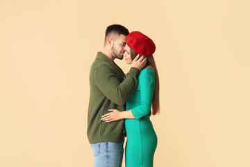 Wall Mural - Happy young couple on color background