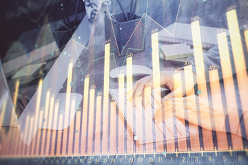 Double exposure of financial graph with man works in office on background. Concept of analysis.