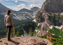 Woman In Gray Coat Stands Above Grinnell Lake