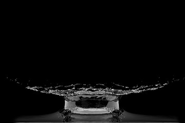 Wall Mural - liquid water droplet collision splash on black background. 3d render