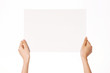 © dohee - Woman hand hold a empty white paper isolated on white.