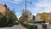 Piac Street With A Leaving Tram And Trees In Vibrant Autumn Colors On A Warm Day In Debrecen City. -wide Shot
