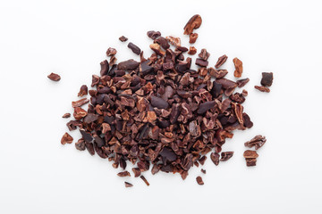 Cacao nibs on white background