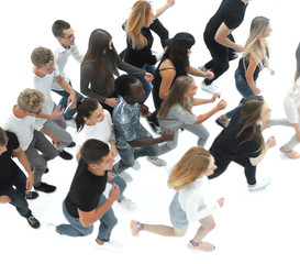 Wall Mural - top view. a group of young people walking together in a row.