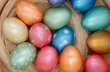 color easter eggs in basket isolated on white