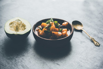 Wall Mural - Kaccha Papita Sabji or Raw Papaya Sabzi, served in a karahi or bowl. selective focus