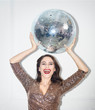 © gpointstudio - Beautiful woman with disco ball