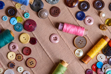 Poster - Background and texture of multicolored antique buttons and sewing tools