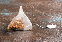 Triangle Infusion Tea Bag On Brown Background