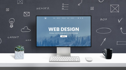 Wall Mural - web design studio concept with web design portfolio page on computer display. office work desk
