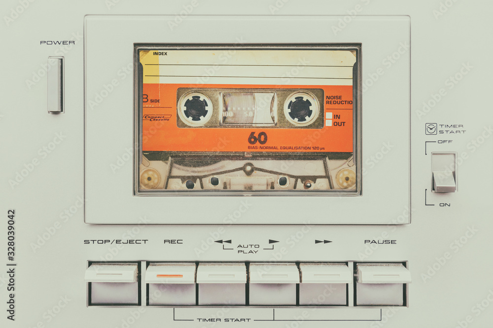 Retro styled image of a vintage audio cassette player - obrazy, fototapety, plakaty 
