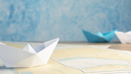 Wall Mural - Paper boat on an office table