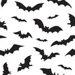 Seamless pattern with black bats. Scary vampire bat silhouettes background. 