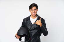Man Holding A Motorcycle Helmet Over Isolated White Background Making Phone Gesture