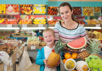 Woman and son with shopping cart