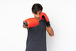 © luismolinero - Sport man over isolated white background with boxing gloves
