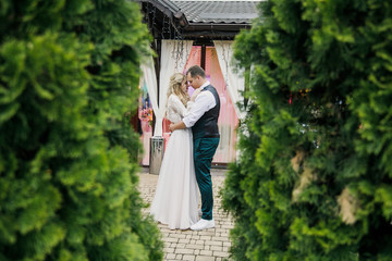 beautiful boho style wedding ceremony. The bride in a beautiful dress and the groom in a classic suit