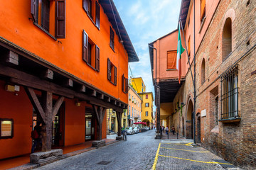 Wall Mural - Old narrow street in Bologna, Emilia Romagna, Italy. Architecture and landmark of Bologna. Cozy cityscape of Bologna.