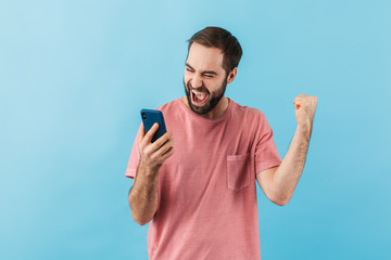 Sticker - Portrait of a young cheerful bearded man wearing t-shirt