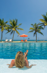 Sticker - Beautiful woman relaxing in a pool at summer