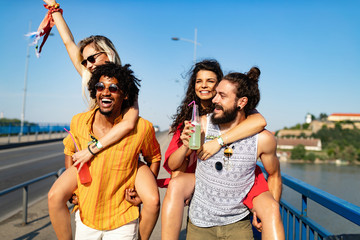 Wall Mural - Happy group of friends having fun, travelling and smiling