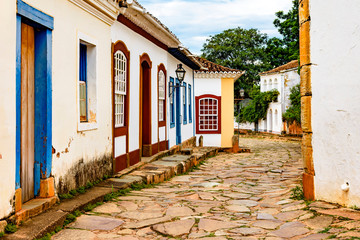 Paving stones made by slaves on the streets with colonial-style houses in the city of Tiradentes built in the 18th century