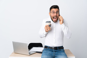 Poster - Young businessman holding a mobile phone