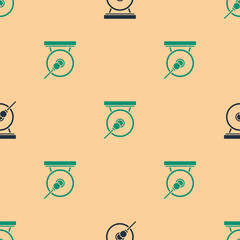 Green and black Gong musical percussion instrument circular metal disc and hammer icon isolated seamless pattern on beige background. Vector Illustration